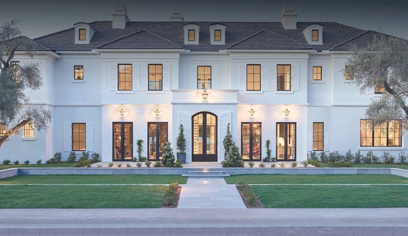 Large home with beautiful custom iron doors and windows in Dallas from Adooring Designs